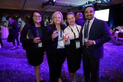 people standing at conference at a party