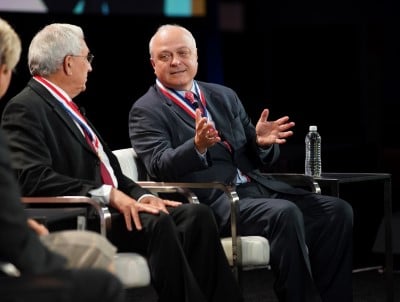 two men eating at ism world conference 2023