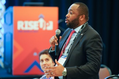 Man speaking at ism world annual conference
