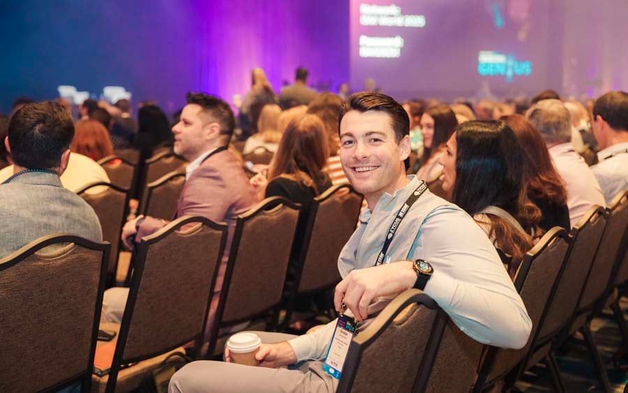 man smiling for photo at ism world 2025