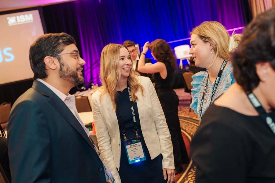 people interacting at ism world 2025