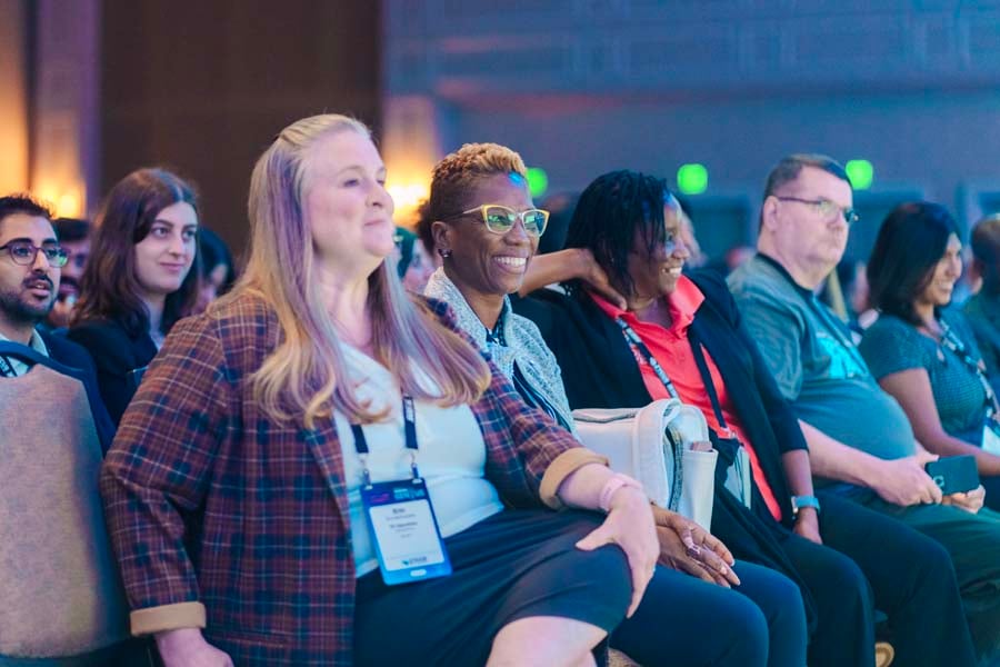 Attendees smiling while attending ISM World 2025