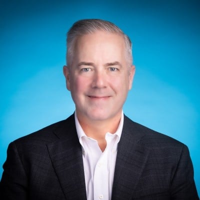 man in suite with blue background