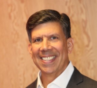 man smiling wearing suite