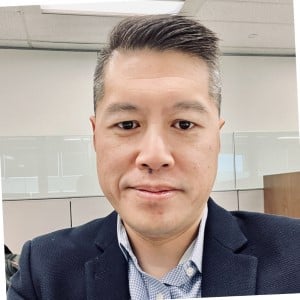 man with short hair headshot