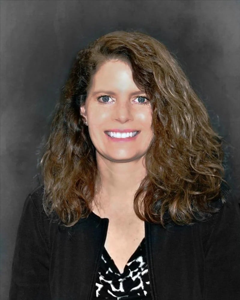 curly brown hair woman smiling