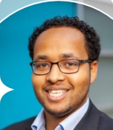 man smiling with suite on