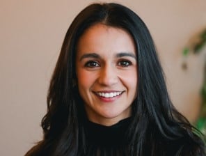 women wearing sweater smiling for headshot photo