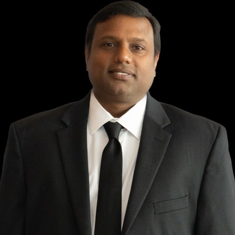 man in suite with brown hair smiling
